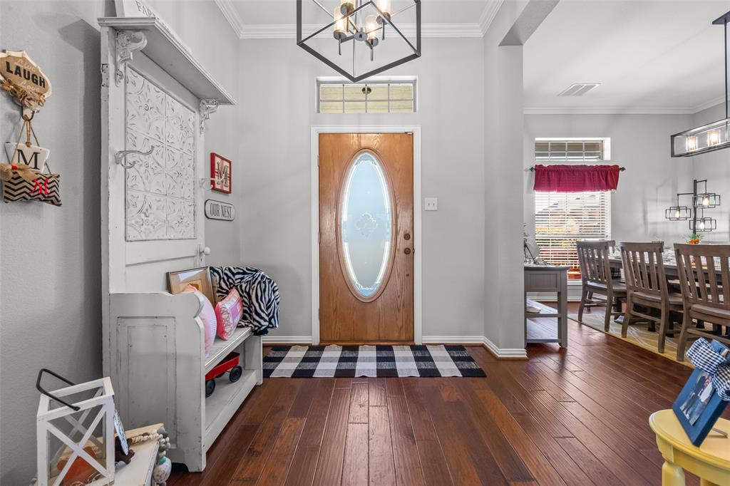 11277 Emerald Ranch Lane Forney, TX 75126 - Photo 5 of 32 an entryway with wooden floor