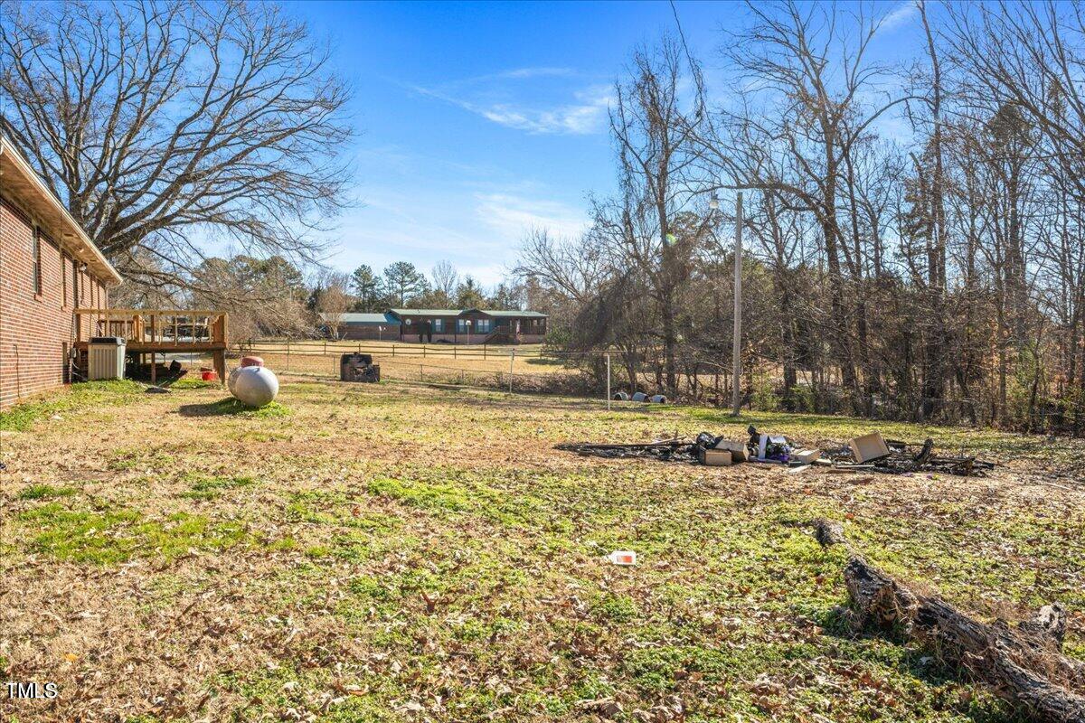 2540 Mayo Lake Road Roxboro, NC 27574 - Photo 21 of 24 a view of a lake with a house