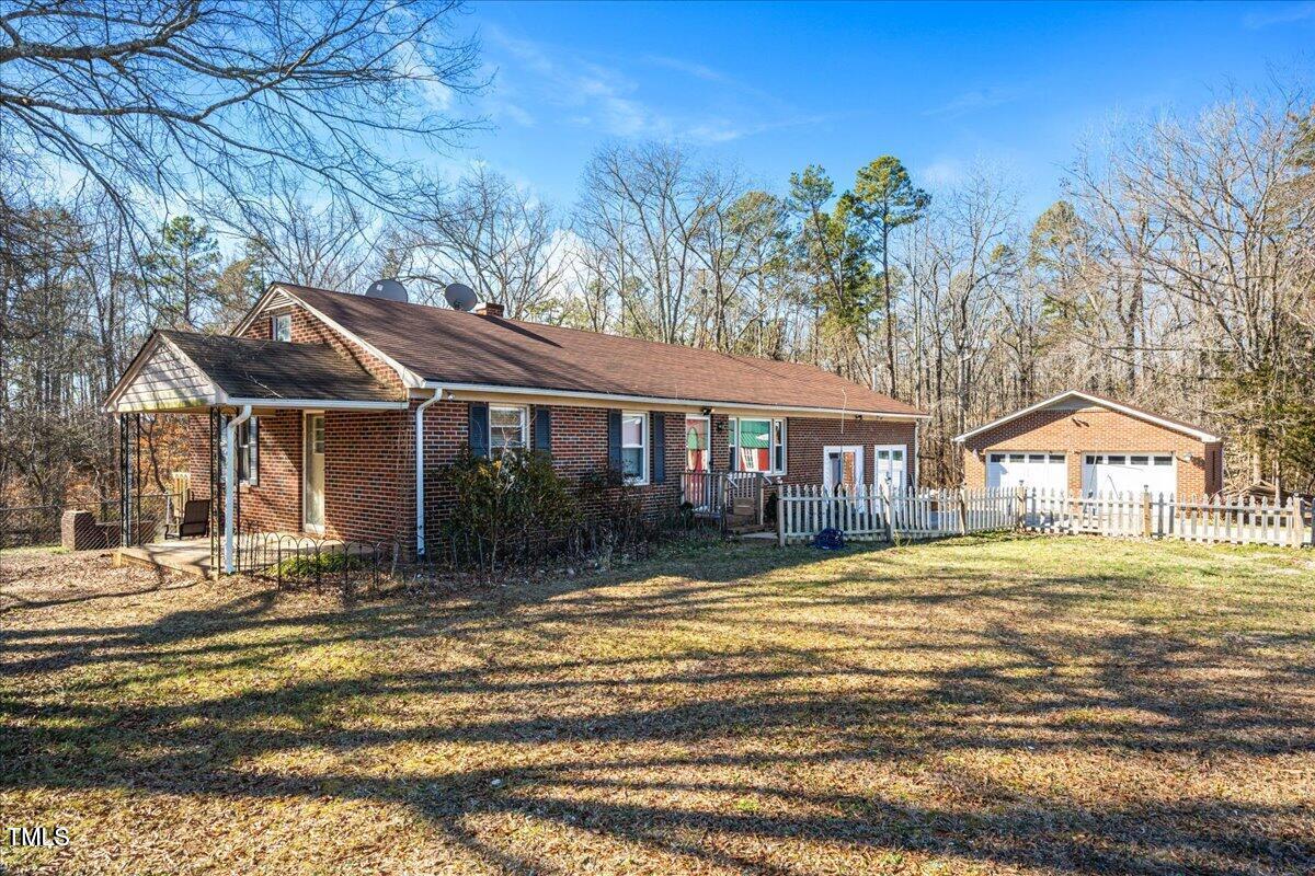 2540 Mayo Lake Road Roxboro, NC 27574 - Photo 3 of 24 a front view of a house with a yard