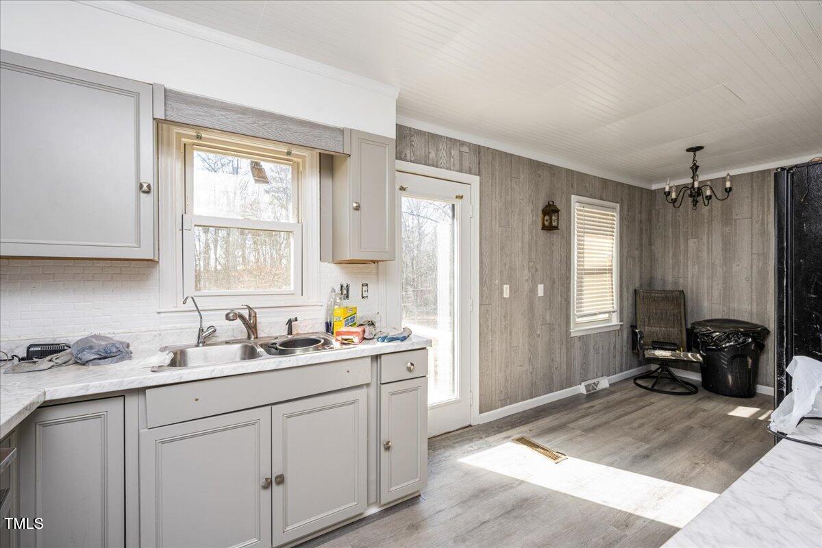 2540 Mayo Lake Road Roxboro, NC 27574 - Photo 8 of 24 a kitchen with a sink and cabinets