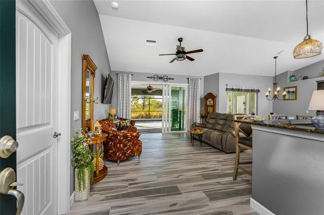 a living room with furniture and a large window