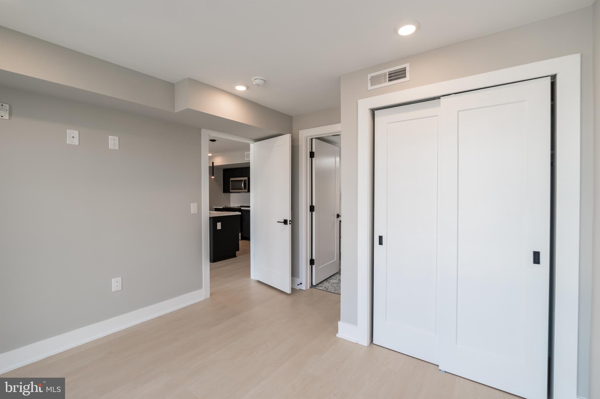 6604 Ridge Avenue, Unit 309 Philadelphia, PA 19128 - Photo 11 of 13 a view of a big room with closet and windows