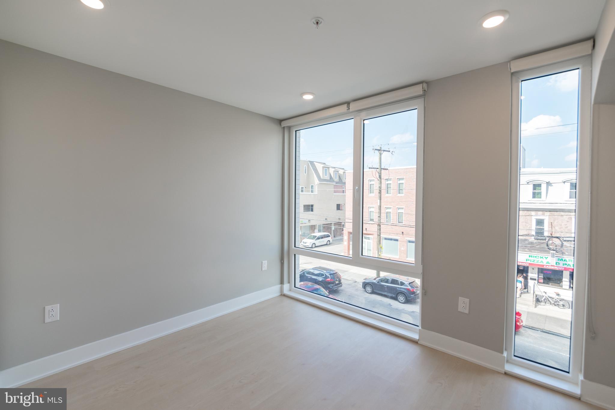 6604 Ridge Avenue, Unit 309 Philadelphia, PA 19128 - Photo 12 of 13 a view of an empty room with a window