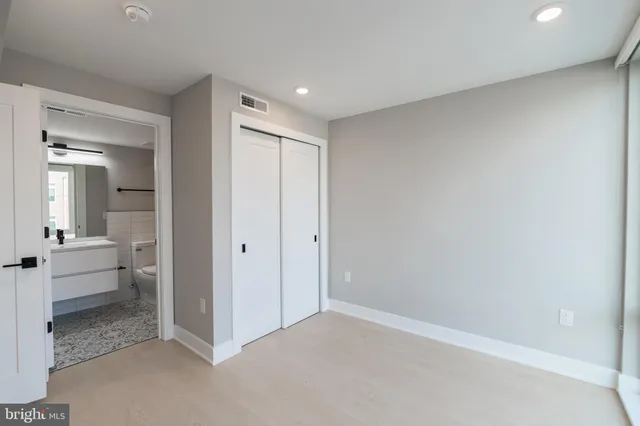 a view of a bathroom with a tub and shower