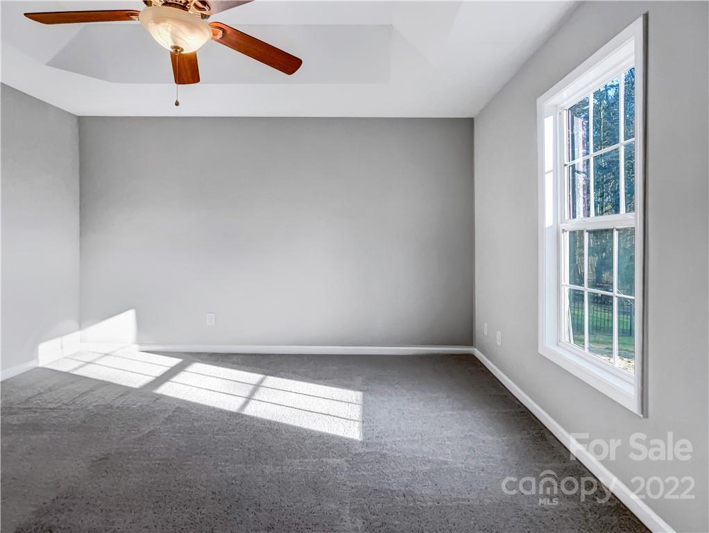 312 Springhill Lane Maiden, NC 28650 - Photo 11 of 18 an empty room with windows and fan