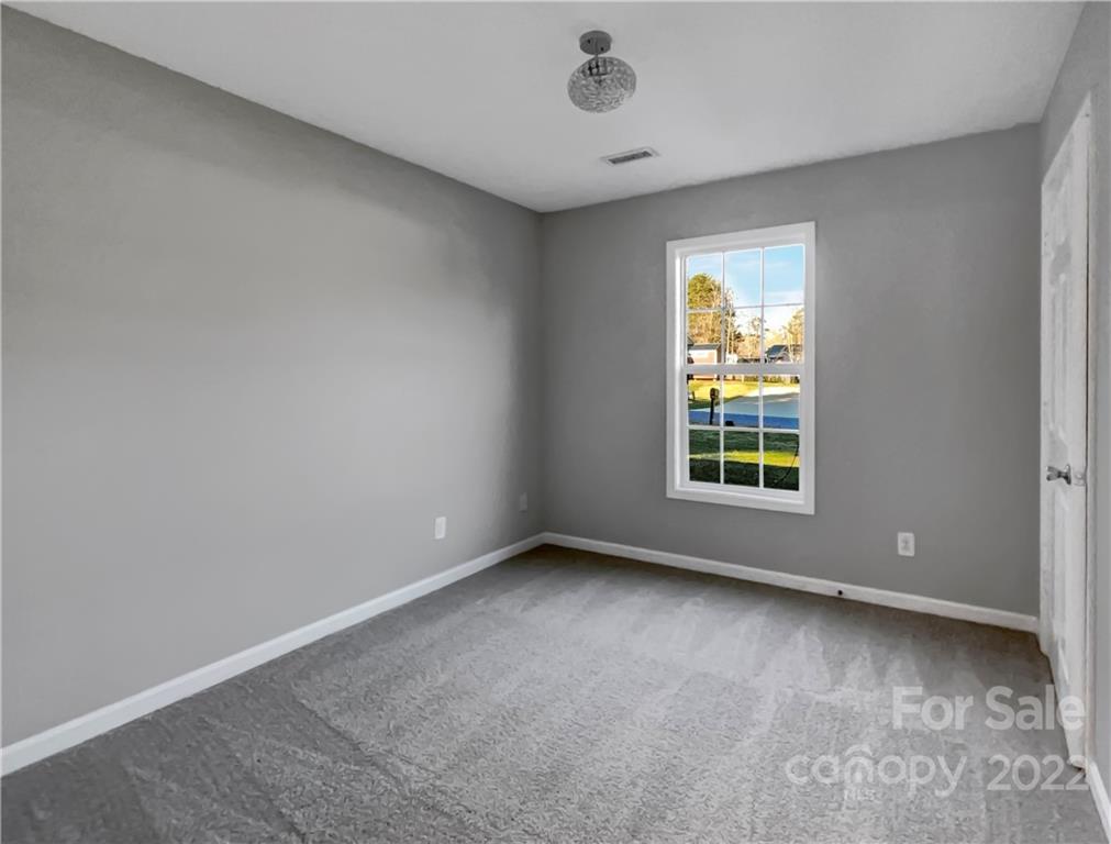 312 Springhill Lane Maiden, NC 28650 - Photo 12 of 18 an empty room with a window
