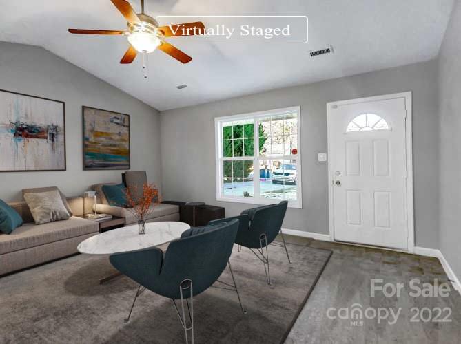 312 Springhill Lane Maiden, NC 28650 - Photo 3 of 18 a living room with furniture a chandelier and a window