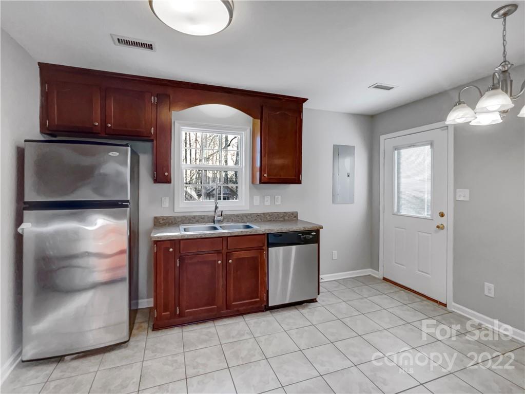 312 Springhill Lane Maiden, NC 28650 - Photo 7 of 18 a kitchen with stainless steel appliances granite countertop a refrigerator and a sink