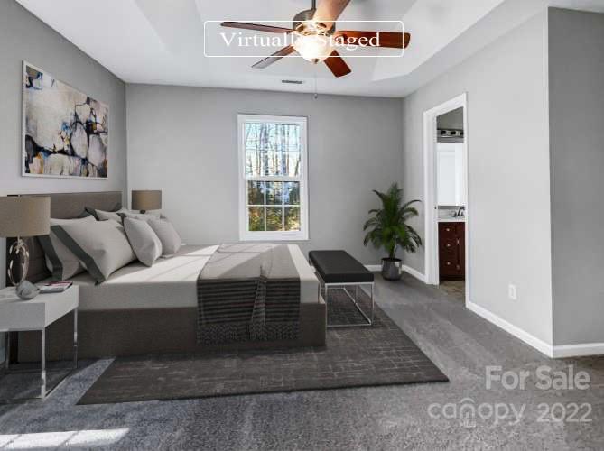 312 Springhill Lane Maiden, NC 28650 - Photo 8 of 18 a spacious bedroom with a balcony a bed and a chandelier
