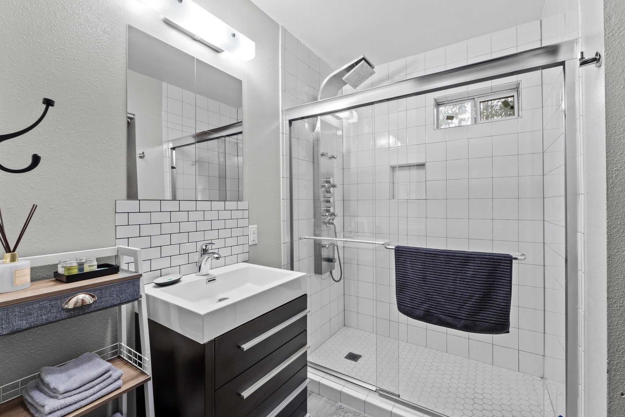 4512 Speedway, Unit A Austin, TX 78751 - Photo 27 of 39 a bathroom with a sink and a mirror