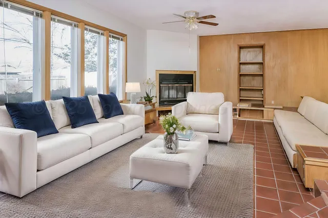 a living room with furniture and a large window