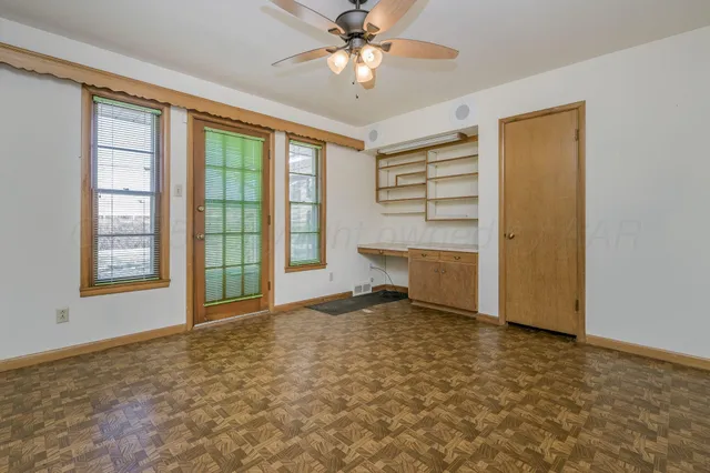 a view of an empty room with a window