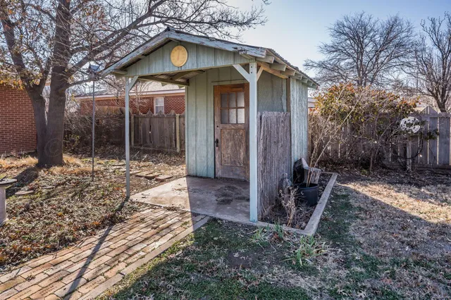 a house with trees in the background
