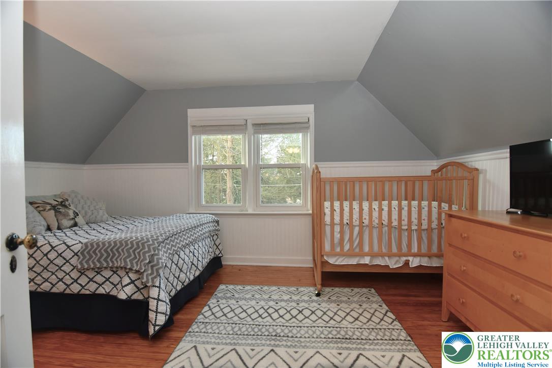 915 Birch Road Hellertown, PA 18055 - Photo 18 of 32 a bedroom with a bed and flat screen tv