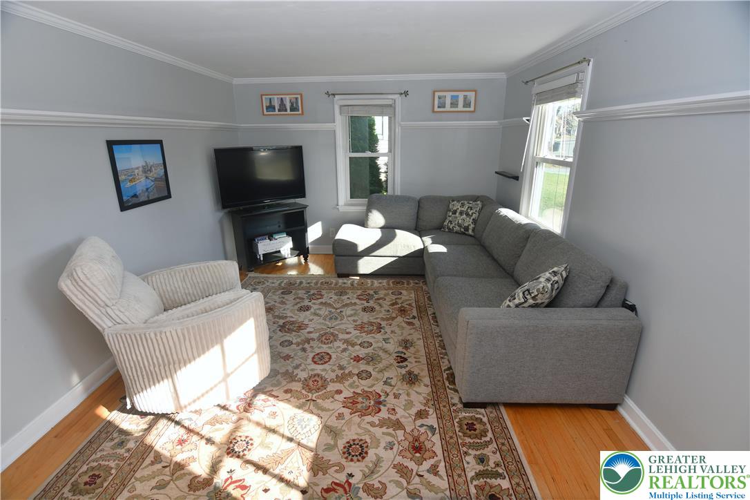 915 Birch Road Hellertown, PA 18055 - Photo 3 of 32 a living room with furniture and a flat screen tv
