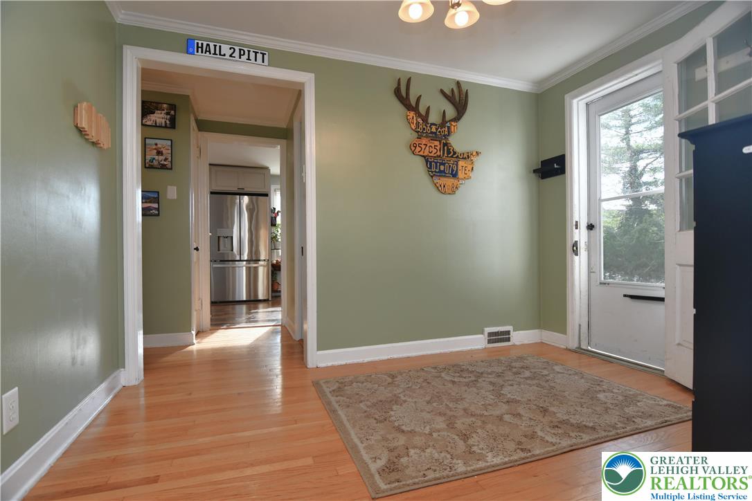915 Birch Road Hellertown, PA 18055 - Photo 8 of 32 a view of a hallway view with wooden floor and staircase