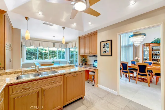 a living room with dining table and chairs