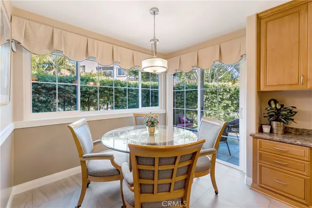 a living room with furniture potted plant and a fireplace