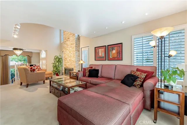 a living room with furniture and stairs