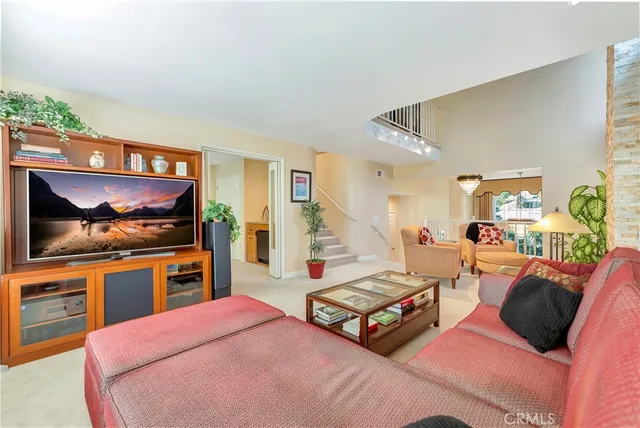 a living room with furniture flower pot and a fireplace