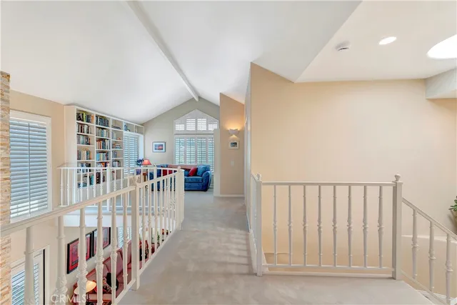 a bedroom with furniture and a flat screen tv