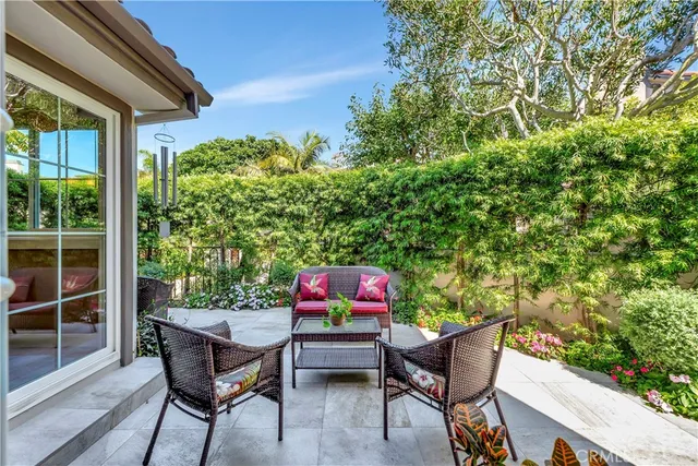 a backyard of a house with outdoor seating