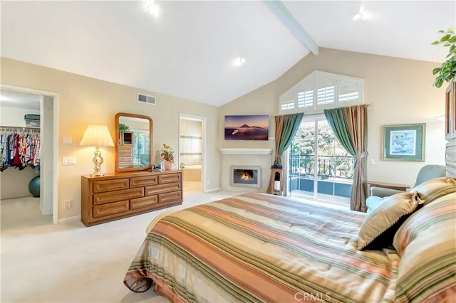 a bathroom with a granite countertop tub sink and mirror
