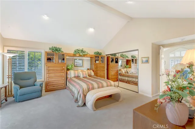 a living room with furniture and a book shelf