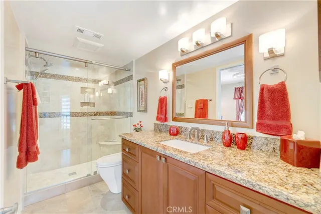 an aerial view of multiple houses with a yard