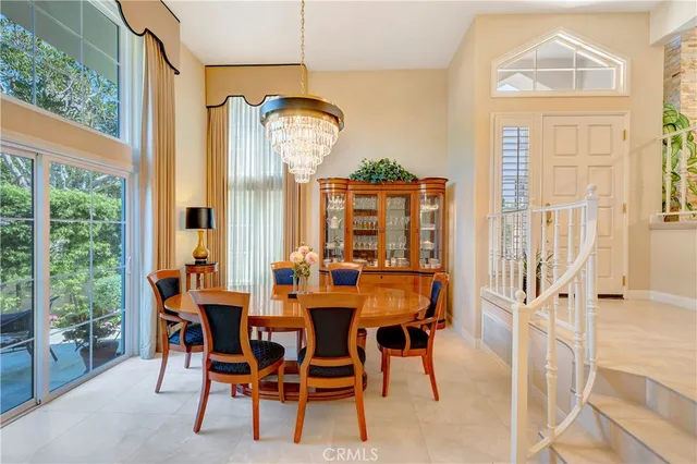 a view of a dining room with furniture and a large window