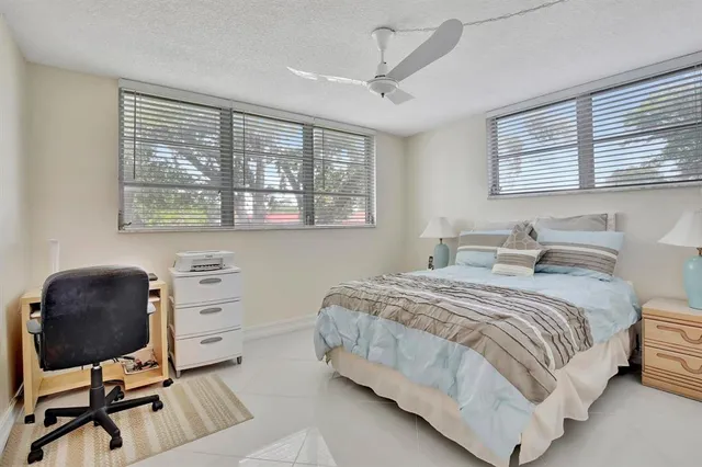 a view of a swimming pool with a lawn chairs
