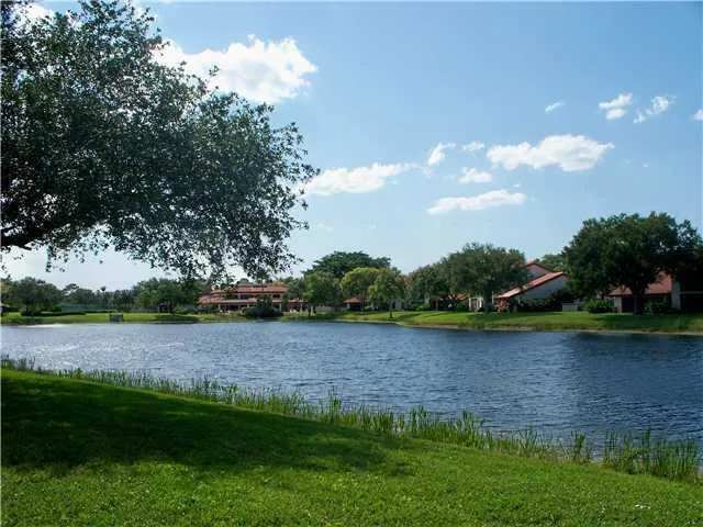 an aerial view of a house with garden space and street view