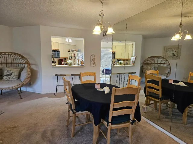 a large bedroom with a bed and flat screen tv