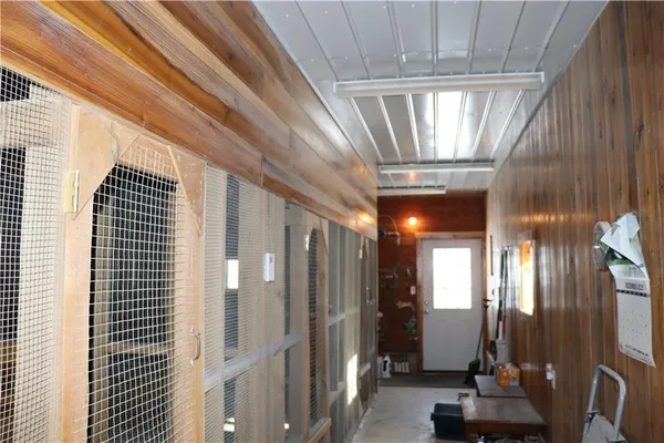 a dining room with furniture and a chandelier