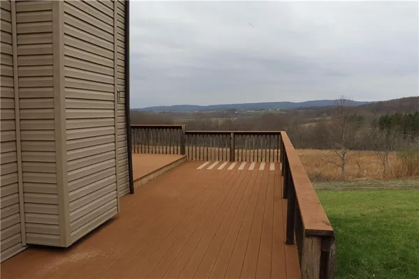 a view of roof deck with two chairs