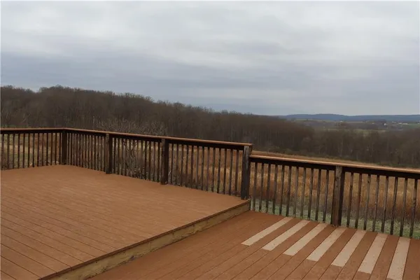 a balcony with view of city and lake