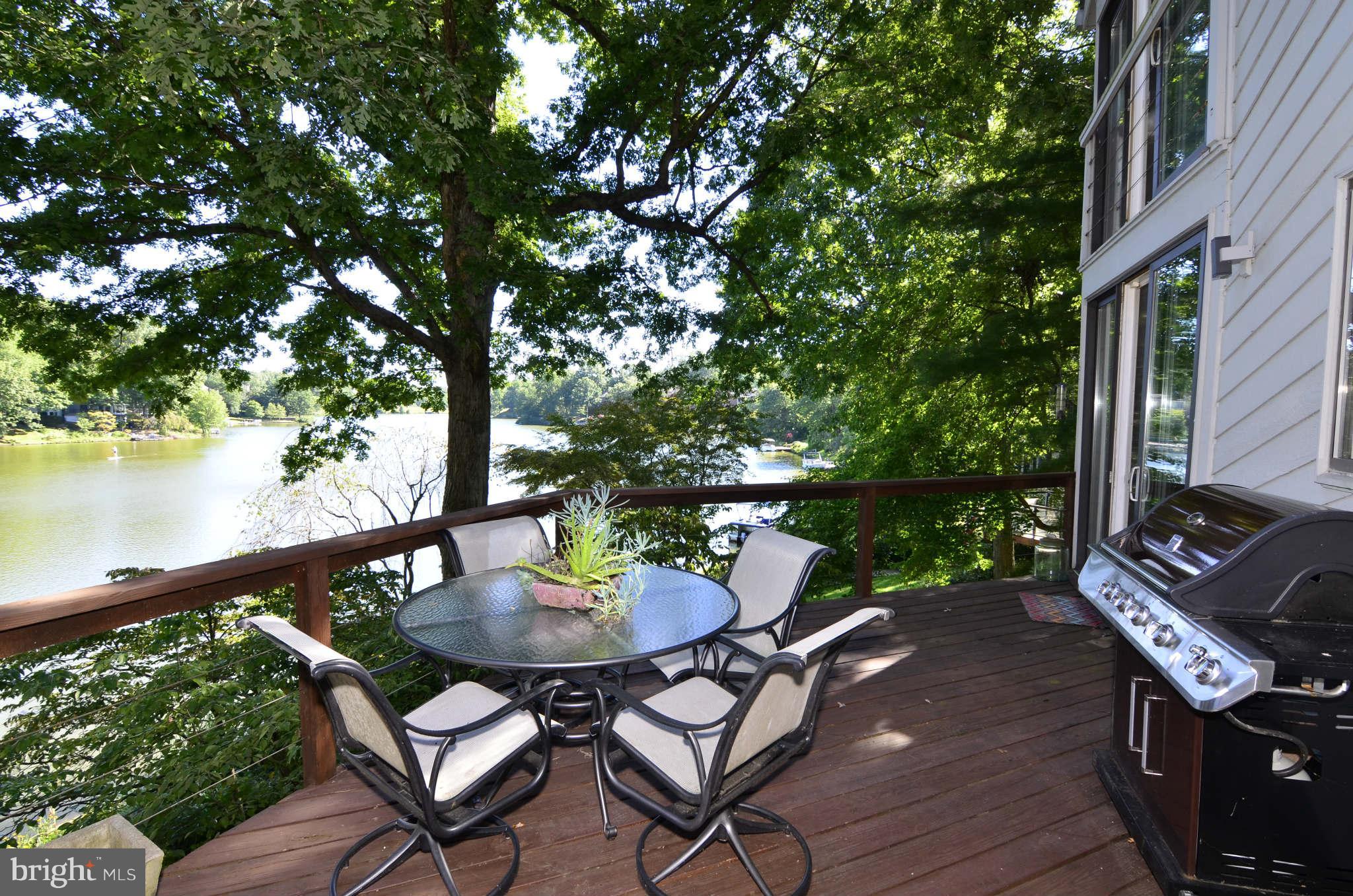 2205 Burgee Court Reston, VA 20191 - Photo 8 of 30 A view of the main level deck and lake.