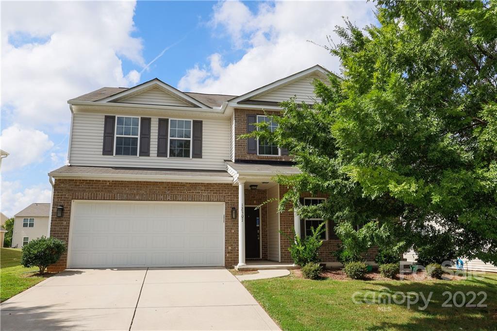 12507 Bending Branch Road Charlotte, NC 28227 - Photo 1 of 23 a front view of a house with garden