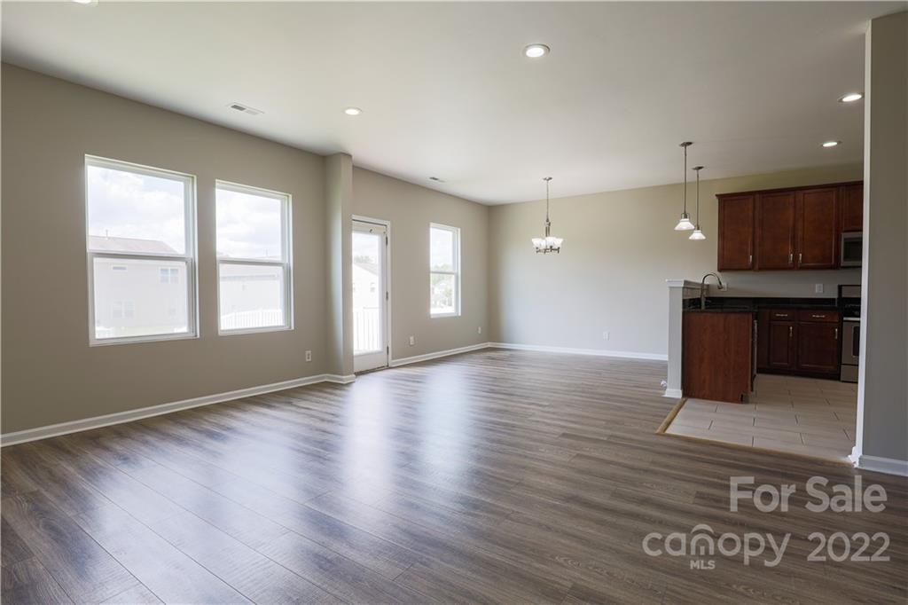 12507 Bending Branch Road Charlotte, NC 28227 - Photo 15 of 23 a view of a kitchen with a sink and a microwave