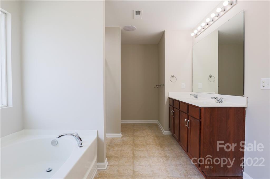 12507 Bending Branch Road Charlotte, NC 28227 - Photo 19 of 23 a bathroom with a sink and a bathtub