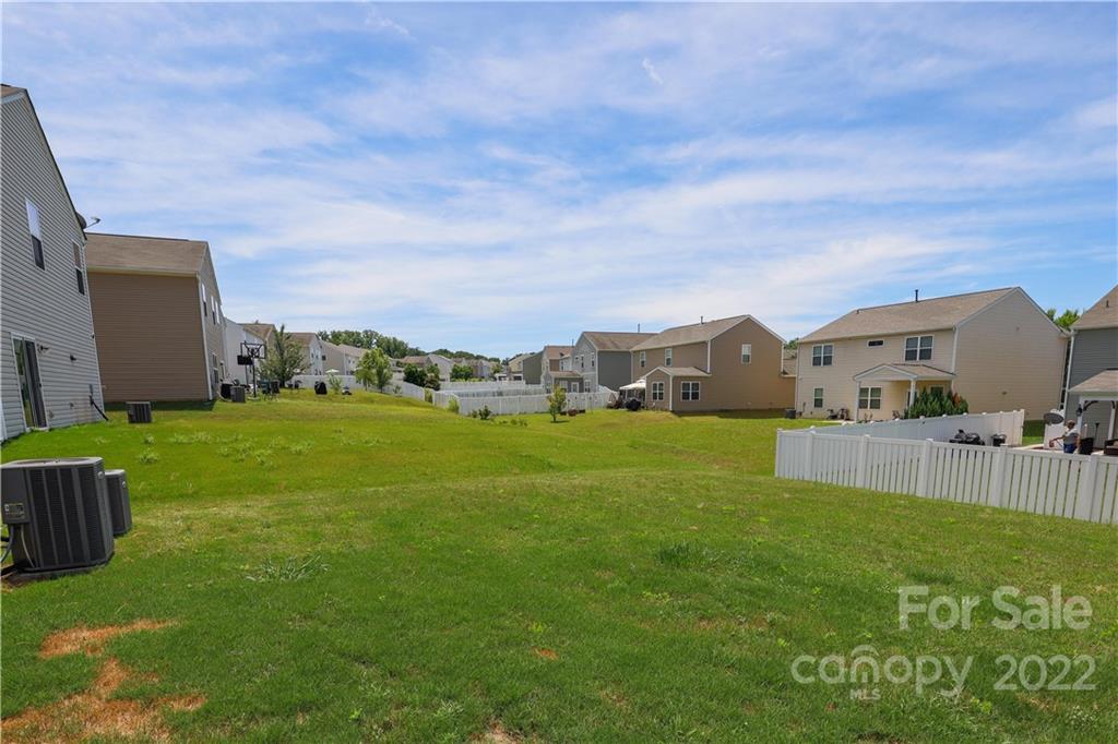 12507 Bending Branch Road Charlotte, NC 28227 - Photo 22 of 23 a view of a house with a big yard