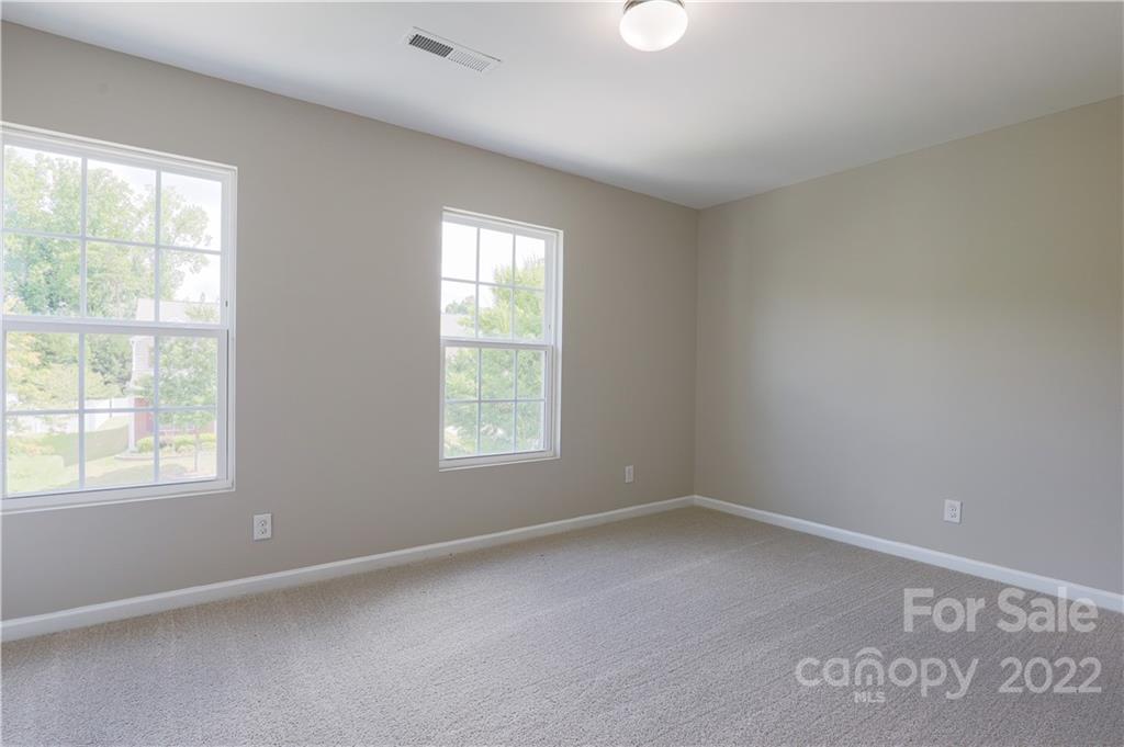12507 Bending Branch Road Charlotte, NC 28227 - Photo 5 of 23 an empty room with a window