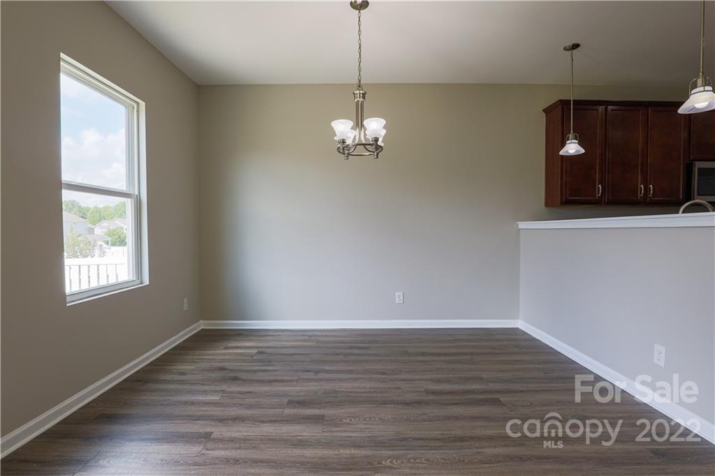 12507 Bending Branch Road Charlotte, NC 28227 - Photo 10 of 23 a view of a livingroom with wooden floor