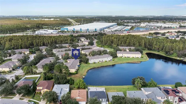 an aerial view of a house with a lake view