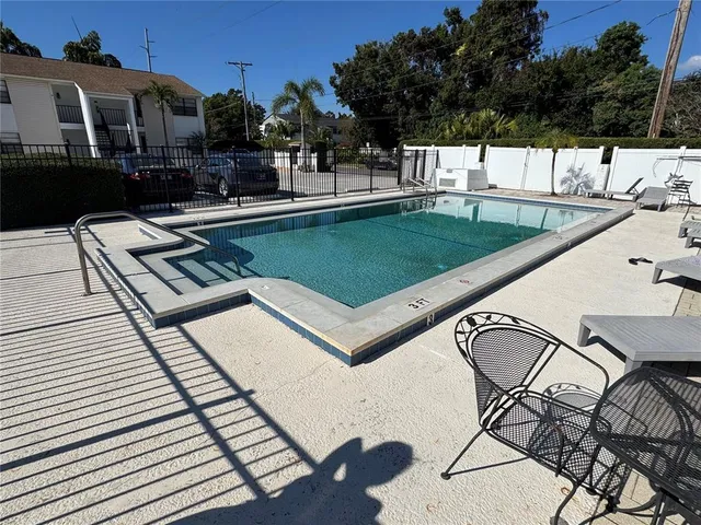 a view of a swimming pool with a patio