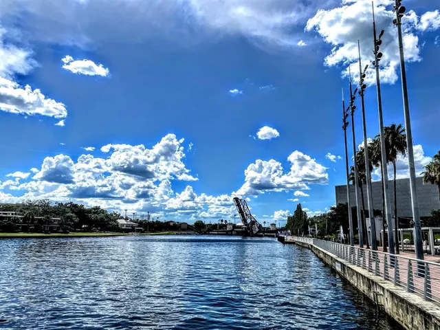 a front view of building with cars parked