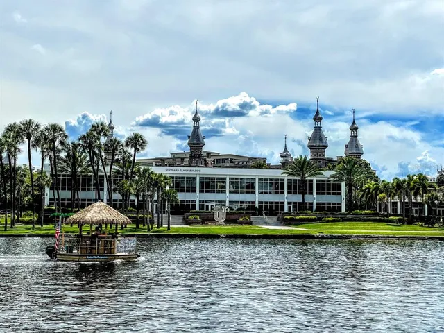 a view of a building with car parked