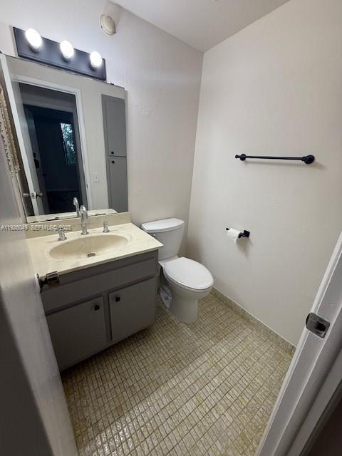 4200 Hillcrest Drive, Unit 206 Hollywood, FL 33021 - Photo 13 of 15 a bathroom with a sink toilet and mirror