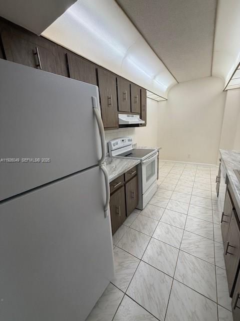 4200 Hillcrest Drive, Unit 206 Hollywood, FL 33021 - Photo 8 of 15 a kitchen with stainless steel appliances a refrigerator sink and microwave