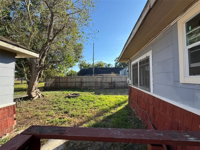 a view of a backyard of the house